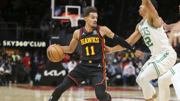 Nov 17, 2021; Atlanta, Georgia, USA; Atlanta Hawks guard Trae Young (11) is defended by Boston Celtics forward Grant Williams (12) in the first quarter at State Farm Arena. Mandatory Credit: Brett Davis-USA TODAY Sports